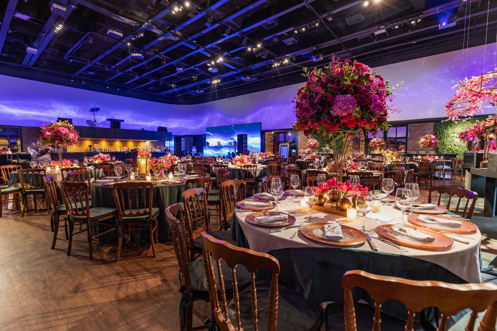 Reception tables set with flowers and candles